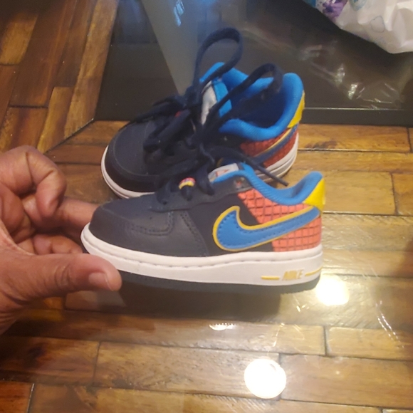 navy blue and orange air force ones